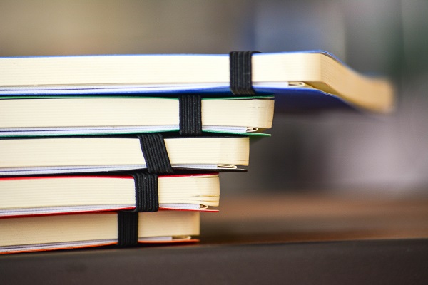 Stack of colourful notebooks